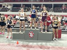 Lauren McDermott, left, took 5th place with a school record breaking time in the 60 meter hurdles. She ran the race in 9.6 seconds in the Class B Dan Lennon Invite at the University of South Dakota in Vermillion on March 19. Submitted photos
