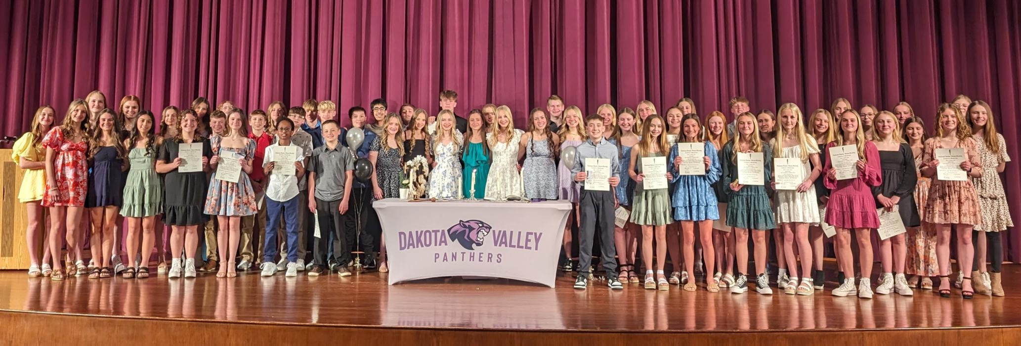 The Dakota Valley Middle School 2024 National Junior Honor Society induction happened on Monday, March 4. All current 7th and 8th grade members gathered on-stage at the end of the ceremony for congratulations and photos. Photos by Kelly Riibe • times2reporter@gmail.com