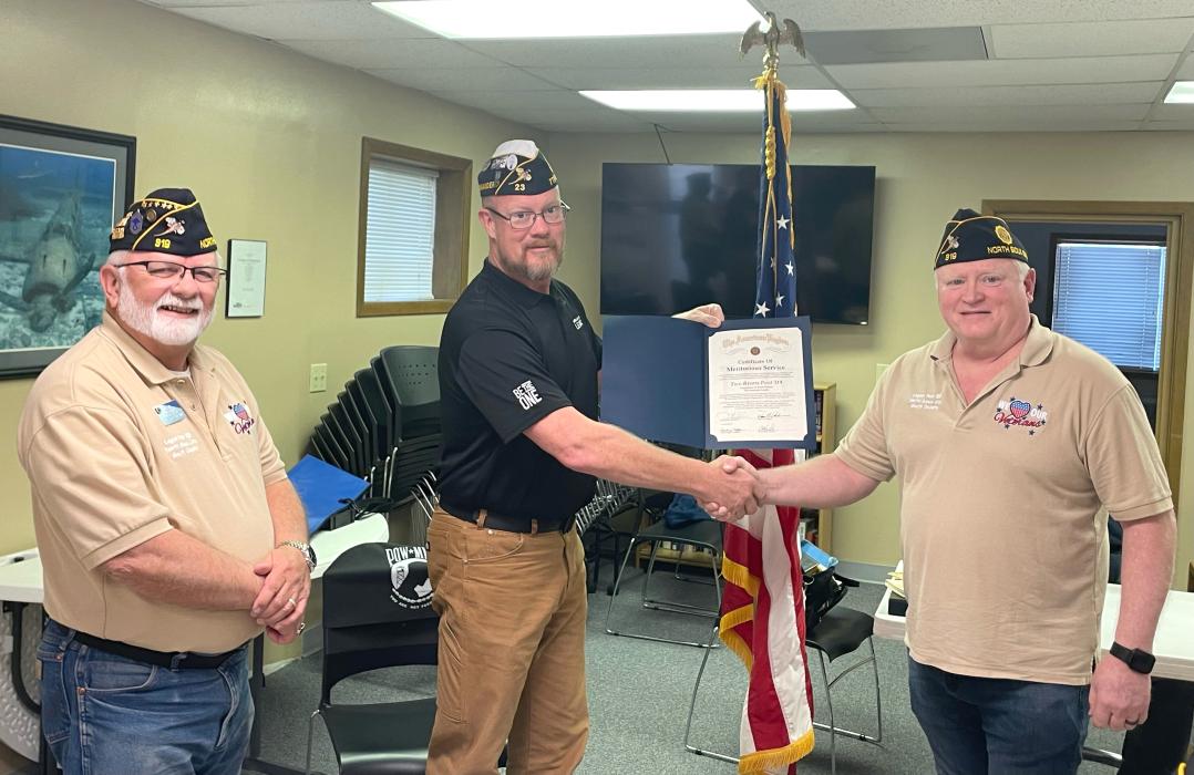 Former SD American Legion Post #319 Commander Michael Kumm passes the torch to 2024 Commander Timothy Waugh. Assisting with the process of installation is Commander Andy Lyngen of the SD American Legion District 7 Post. Submitted photos