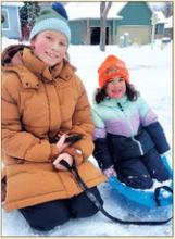 Zoey Anderson pulls Evelyn Wanning on a sled throughout the Dakota Dunes neighborhood.  Jack Galles, of Dakota Dunes, had fun playing with friends on the Jan. 19 snow day.  Photos by Kelly Riibe • times2reporter@gmail.com
