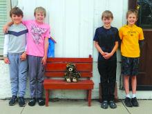 In July a carved bear was stolen on a Friday between the hours of 3-9 a.m. The owner put a sign out on their bench where the carved bear was missing with a sad face with tears and a message that said, “Please bring my bear back.”  Four boys (triplets and their cousin) placed a stuffed bear on my bench Labor Day weekend when the owners were gone.  The boy went to the house Saturday, Sept. 10 and knocked on the door to tell the owners they were the ones who replaced my stolen bear.  They said, “Don’t worry if
