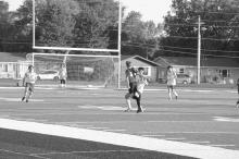 Ben Phillips beats a Vermillion athlete to the ball. Photo by Kelly Riibe • times2reporter@gmail.com