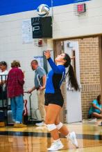 Ashley Brewer takes her turn at the serving line against the Canton C-Hawks Sept. 8. Photo by Peterman Sports Photography • photoman@iw.net