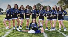 Cheering on the Huskies this year are, front, Gracelynn Bruns; and back, from left, Addison Chase, Laila Peters, Kloe Spalding, Jaydan Provost-Shay, Megan Munkvold, Madison Miller, Briseis Love, Haley Harkness and Exandria Stultz. Photo by Peterman Sports Photography • stevepeterman5@gmail.com