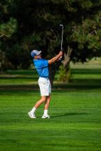 Evan Hailey, a senior, watches his ball go down the fareway at the Husky Invite Sept. 15. Photo by Peterman Sports Photography • photoman@iw.net