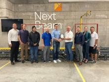 The North Sioux City Economic Development Corporation (NSCEDC) named Next Beam as the September Business of the Month. Pictured are, from left, NSCEDC Executive Director Andrew Nilges, Governor’s Office of Economic Development Tanner Beukelman, Operator Daron Ratliff, NSCEDC Director John Stevens, NextBeam CEO Andrew Patton, NSCEDC Board President Mike Huber and NSCEDC Directors Dustin Pratt, Megan Moore and Jamie Wankum. Submitted photo