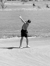 Tate Cornelsen swings out of the bunker and takes 1st place in the Junior Varsity contest at Beresford.  Submitted photo
