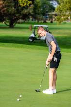 Hudson TenNaple sinks a putt at the Husky Invite Sept. 15. He was a flight champion and helped lead the Panthers to a 1st place team title. Photo by Peterman Sports Photography • photoman@iw.net