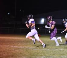 Ethan Anema, in a quarterback sneak, kept the ball to run it in for the first TD of the game. Photo courtesy of Grant County Review