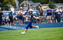 Benjamin Swatek celebrates as he crosses into the endzone. He had 3 touchdowns against the Sioux Valley Cossacks Sept. 2. Photo by Peterman Sports Photography • photoman@iw.net