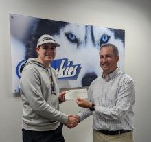 he Scheels Give Back program is a way to give back to their communities and to those in need. Every year, the Scheels associates are provided with the opportunity to give to a need in the community that they are personally passionate about, to give to an individual in need or to participate in a random act of kindness. Hunter Geary, pictured at left, is a former EPJ golfer and currently runs the Golf Pro program at Scheels picked the EPJ golf program to receive the donation. Head golf coach Kelly Haberling 