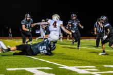 Connor Maltas sacks the quarterback. Photo by Peterman Sports Photography • stevepeterman5@gmail.com