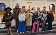 A program titled “For All of the Saints!” was held at St. Teresa of Calcutta’s, in Dakota Dunes, on the evening of Wednesday, Oct. 26. Sixth graders in the religious education class, taught by Phil Kratz, dressed as saints and gave a short speech. Each student was able to choose their own saint to research and speak about him or her in front of the crowd at the church. Joan of Arc and St. John the Baptist were just a few of the highlighted saints. Parents, parishioners and K-5th graders were in attendance t