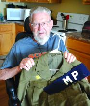 Jim McDonald with his military police uniform from WWII. Photo by Kelly Riibe