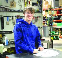 Christian Mueller is currently working on removing a film covering from a metal disc so that others within Steele Eagle and Rugged Gear can continue to manufacture products. Photos by Beth Sherard-Hutcheson times1 reporter@gmail.com