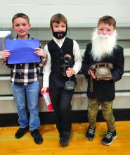 Greyson Sprock, Alex Redler and Graham Riibe were all Alexander Graham Bell for the DVES’s Living Timeline Nov. 22.  Photo by Kelly Riibe • times2reporter@gmail.com