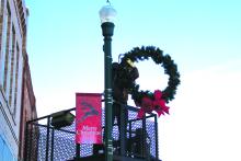 A telltale sign that Christmas is around the corner is the decorating of Main Street Elk Point’s light poles. City workers added the festive adornments Monday, Nov. 28 while the temperatures held before a predicted snowstorm hit the area. Photo by Beth Sherard-Hutcheson times1reporter@gmail.com