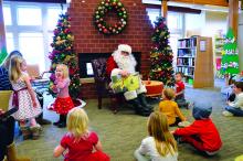 Santa Claus read a story to children at the North Sioux City library Dec. 15. Photos by Kelly Riibe • times2reporter@gmail.com