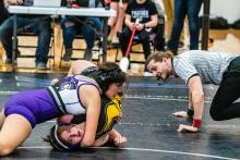 Gracie Delgado watches the ref for his signal that she got the pin over Kenzie King of Canton in the DAK-12 Conference Meet. Photo by Peterman Sports Photography • stevepeterman5@gmail.com