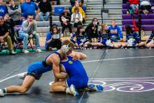 Lucas Hueser grapples against Keaton Vessells of West Central and won by a decision of 7-4. Hueser went on to win the 152 weight bracket. Photo by Peterman Sports Photography stevepeterman5@gmail.com