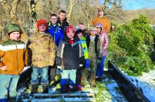 Scouts from Pack and Troop 28 combined to collect 35 Christmas trees from the surrounding area and dropped them off at Dorothy Pecaut so they may be repurposed into mulch in the Spring for Dorothy Pecaut’s trails. Pictured are, from left, Bentley Mahnke, Blake Winters, Aidan Hunt, Aden Garza, Tucker Winters, Carter Hunt, Logan Mahnke, Bretton Clark, Arianna Manke and Isaiah Dunbar-Hoffman. Submitted photo