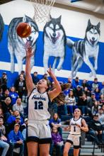 Cera Schmitz scores on a fast break against Ponca Jan. 10. She was the leading rebounder with 9 during the night. PhotobyPetermanSportsPhotography •stevepeterman5@gmail.com