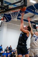 Devon Schmitz beats an Irene-Wakonda defender to the hoop. He had 9 points during the contest. Photo by Peterman Sports Photography • stevepeterman5@gmail.com