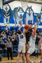 Isaac Bruns pushes his way to the basket in the game against Elk Point-Jefferson Feb. 2. He set the single game scoring record for 46 points in one game. Photo by Peterman Sports Photography stevepeterman5@gmail.com