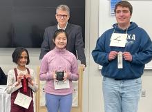Pictured, from left, Nina Purusho (from Rapid City – 2nd place), Iris Liao (Dakota Valley – 1st place) and Elijah Radtke (from Watertown – 3rd place) with their awards from the Regional Spelling Bee at the Dakota Wesleyan School of Business in Mitchell, SD. Submitted photo