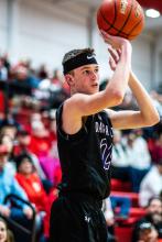 Senior Sam Kleis sinks a 3-pointer against Vermillion Feb. 7 in Vermillion. (
