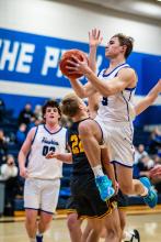 Garrett Merkley had 9 points and 6 assists against Groton Area Feb. 4. (Above) Easton Kempf has been a force under the hoop for the Huskies. In the last three games, Kempf has scored 58 points. Photos by Peterman Sports Photography • stevepeterman5@gmail.com