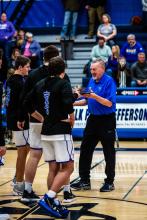 The Huskies presented Gary Nebelsick with a plaque to recognize his 35 years of coaching. Photo by Peterman Sports Photography • stevepeterman@gmail.com