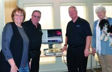 Rabbitt Family Vision Center donated a low vision magnifier to the North Sioux City Community Library. Pictured are, from left, Library Director Liane Welte, Jeff Rabbitt, Dr. Dan Rabbitt and Library Assistant Terri Pace. Photo by Kelly Riibe • times2reporter@gmail.com