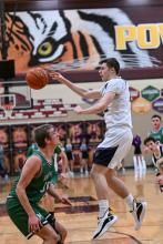 Senior Preston Carlson passes the ball inside to another Panther. He had two assists against the Miller Rustlers. Photo courtesy of Squier Designs