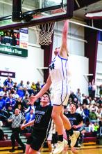 Evan Fornia goes up for the dunk against Waubay/Summit on March 9. Fornia had 13 points during the contest. Photo by Peterman Sports Photography stevepeterman5@gmail.com