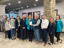 The North Sioux City Economic Development Corporation awarded Peoples Bank as their March Business of the Month. Pictured, from left, are NSCEDC Directors Jamie Wankum, Kathy Gunderson and Megan Moore, Lead Customer Service Representative Payton Hinrickson, NSCEDC Director John Stevens, Retail Banking Officer Wendy Jackson, NSCEDC Board President Mike Huber, NSCEDC Director Dustin Pratt and Customer Service Representatives Dawn Nacke and Hannah Wood. Submitted photo