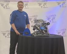 Caden Dial is pictured with the team’s robot 77000X after competing in the CREATE US Open Robotic Championship. Submitted photo