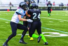 Jacki Waldner (in white) goes to tackle the opponent. Photo submitted