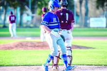 Hunter Geary crosses the plate to score a run for the Huskies. Photo by Peterman Sports Photography stevepeterman5@gmail.com