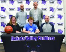 Jaxon Hennies signed to play basketball with DWU.There to witness the signing were front,from left, Amy Hennies, Jaxon Hennies and Jason Hennies; and back, DV Assistant Basketball Coach Trae Bergh and DV Head Basketball Coach Jason Kleis. Photo by Kelly Riibe • times1reporter@gmail.com