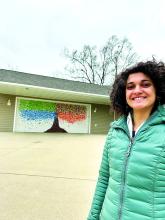 Izzy Curry spent the summer of 2020 painting a four-season tree on the garage of her aunt’s house. Photo submitted