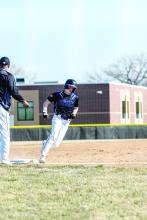 Kade Kessler rounds third base and heads for home plate. Photo by Peterman Sports Photography • stevepeterman5@gmail.com