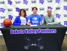 Randy Rosenquist signed to play basketball with DWU. Present for the signing were, from left, Brenna Layhee Rosenquist, Randy Rosenquist and DWU Coach Matt Wilber. DV Basketball coaches Jason Kleis and Trae Bergh were present, but not pictured. Photo by Kelly Riibe • times1reporter@gmail.com