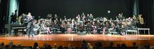 Band Director Daryl Jessen speaks to the crowd as the DV band gets ready to perform at the High School Concert April 21. Submitted photo
