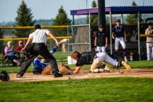 Dakota Valley senior Jaxon Hennies tags out Elk Point-Jefferson senior Christian Mueller as he tried to steal home plate during the Super-Regional game May 21. Photo by Peterman Sports Photography • stevepeterman5@gmail.com