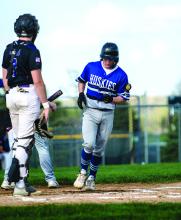 Jake Gale crosses home plate to score 1 of 4 of Elk Point-Jefferson’s runs against Dakota Valley May 9. Photo by Peterman Sports Photography stevepeterman5@gmail.com