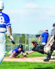 Dakota Valley’s catcher Jaxon Hennies stretches to protect home plate and tag out Elk Point-Jefferson’s Christian Mueller. Hennies got the out. Photo by Peterman Sports Photography • stevepeterman5@gmail.com