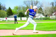 Levi Miller rounds third base and sprints home to score a run. Photo by Peterman Sports Photography • stevepeterman5@gmail.com