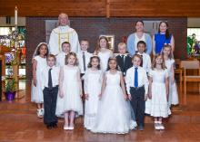 Students of St. Joseph’s and St. Peter’s Catholic Churches received First Communion April 23. Pictured are, front from left, Eli Trudeau, Ellie Schroeder, Agnes Hurlbert, Iris Garcia, Brooks Allard and Hannah Kenagy; middle, Natalie Mickelson, Myles Donnelly, Jett VandeVegte, Brynlee Glover, Garret Adams, Isaiah Buhian and Kella Heirigs; and back, Father Joe, Marcee Irlbeck and Patty Donnelly. Photo by Peterman Photography
