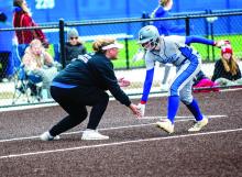 Coach Melissa Curry congratulates Grace Schuh on her homerun as she rounds third base. Photo by Peterman Sports Photography stevepeterman5@gmail.com